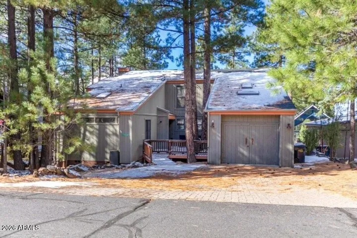 Front elevation. Huge driveway and garage.