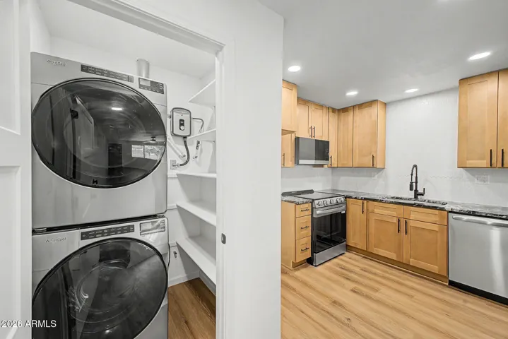 In unit laundry with full sized washer and dryer and pantry