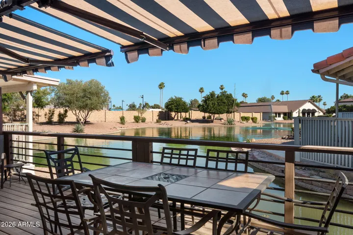 The back patio on the lake with retractable awnings is so relaxing and also great for entertaining!