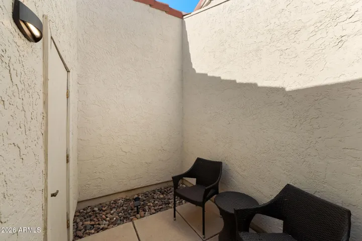 Guest Bedroom patio and entrance to the garage.