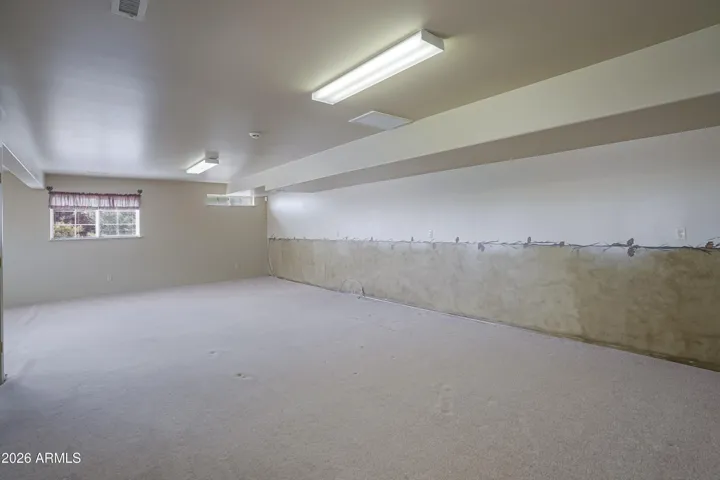 Finished lower level pre-plumbed for optional bathroom