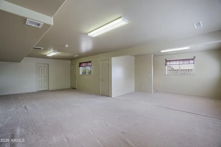 In home access to finished lower level with storage space