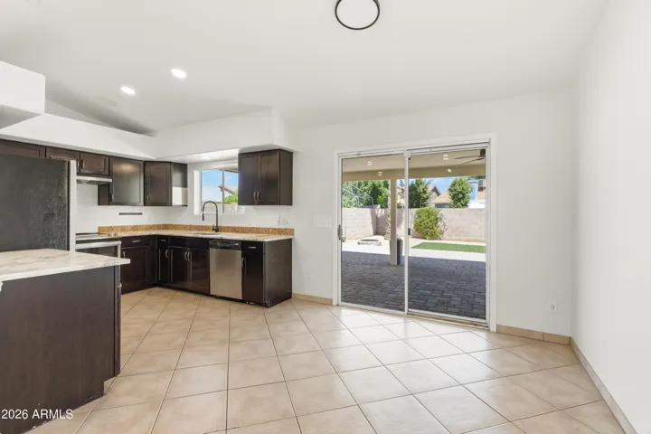 Kitchen and Sliding Door to Large Covered Patio