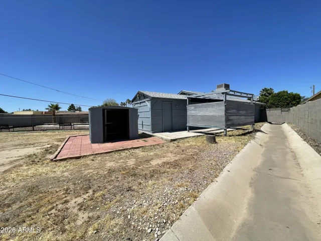 HUGE LOT IS ADJACENT TO THE CITY-INSTALLED DRAINAGE WASH
