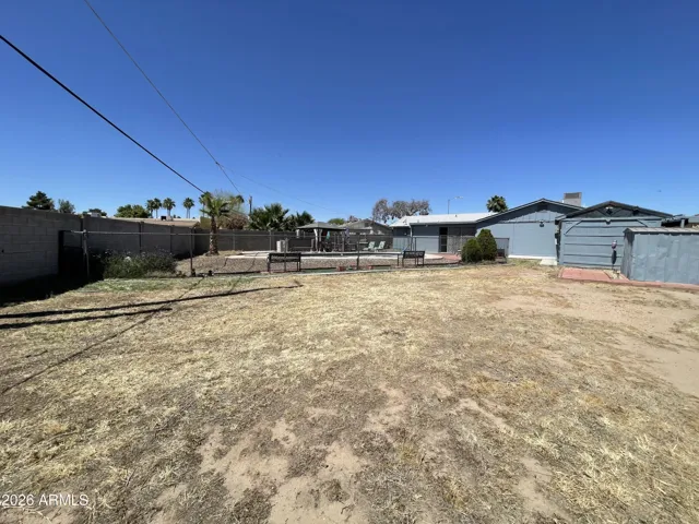FULL BLOCK FENCE SURROUNDING THE PROPERTY