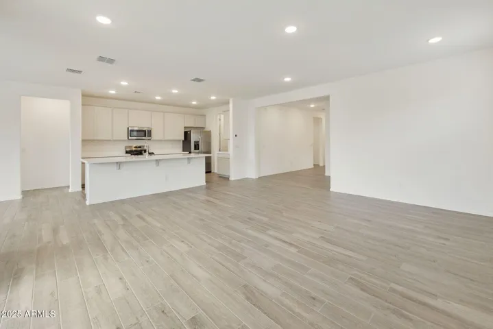 SEEMLESS WOOD PLANK TILE FLOORING DOWNSTAIRS MINUS THE BEDROOMS