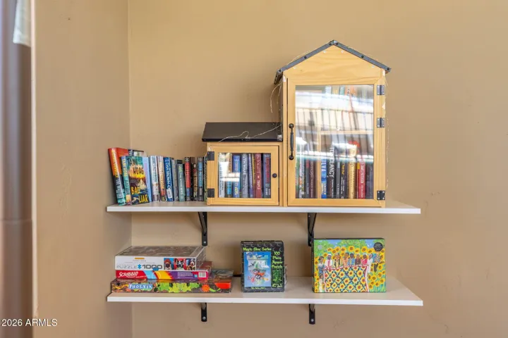 Cozy Scottsdale community reading area with shared books, games, and inviting gathering space perfect for relaxing and socializing.