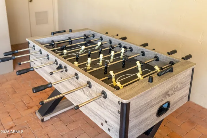 Scottsdale community amenity featuring a foosball table, shaded recreation space, and inviting areas designed for entertainment and social gatherings.