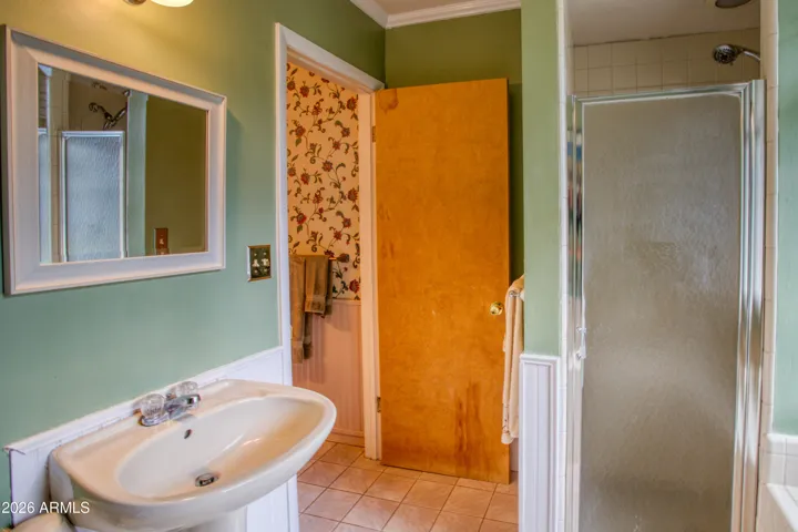 Bathroom 5 (ensuite to Bedroom 5) w/ separate tub & shower and dual sinks