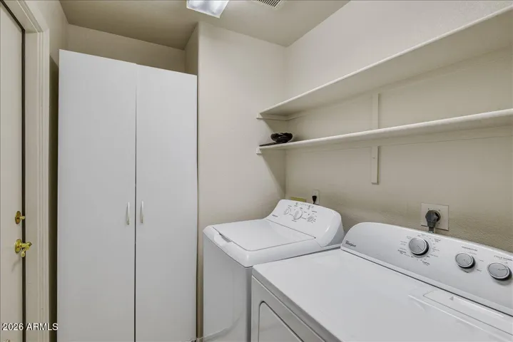 A dedicated laundry room provides extra storage and organization for maximum convenience.