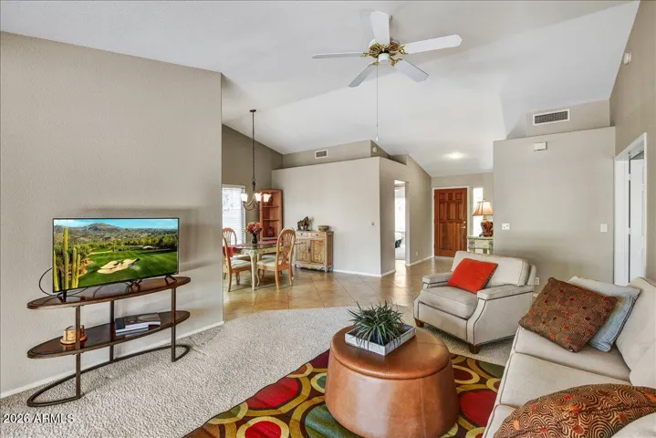 A cozy alternative view of the living area featuring plush, well-maintained carpeting—ideal for relaxing evenings.