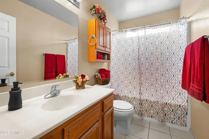 The main bath has ample storage .