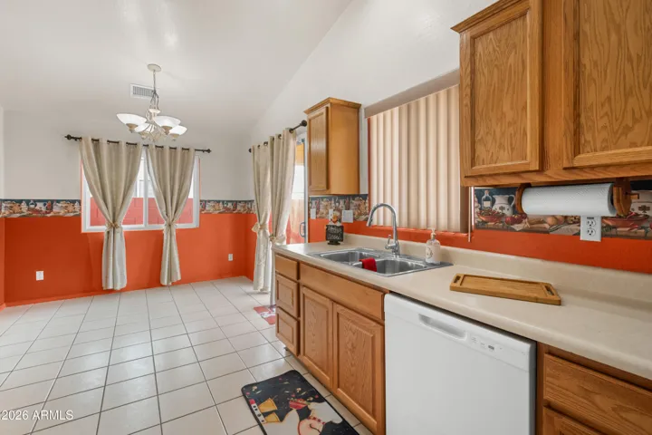 Dining in the kitchen with sliding glass door to awesome back yard!