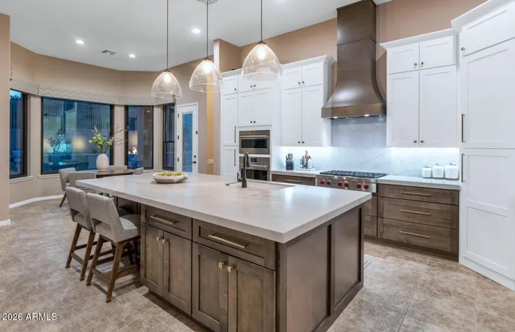 Hidden walk-in pantry with motion activated lighting.