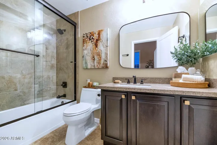 This ensuite full bathroom is located in bedroom 2.