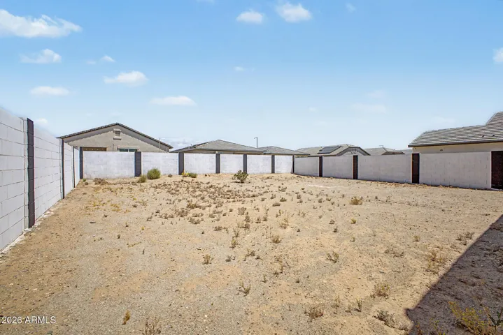 Blank canvas backyard with plenty of space to add a pool, patio, or personalized landscaping.