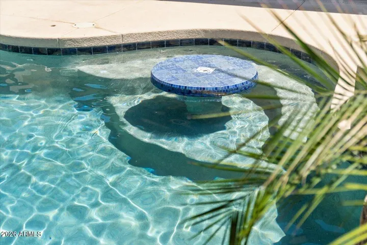 UMBRELLA TABLE INSIDE POOL