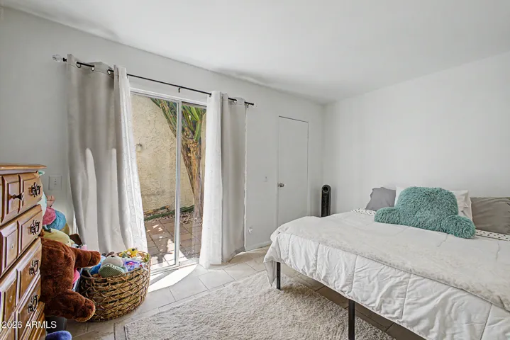 Private exit to courtyard and walk in closet. Slider is new with low e glass.
