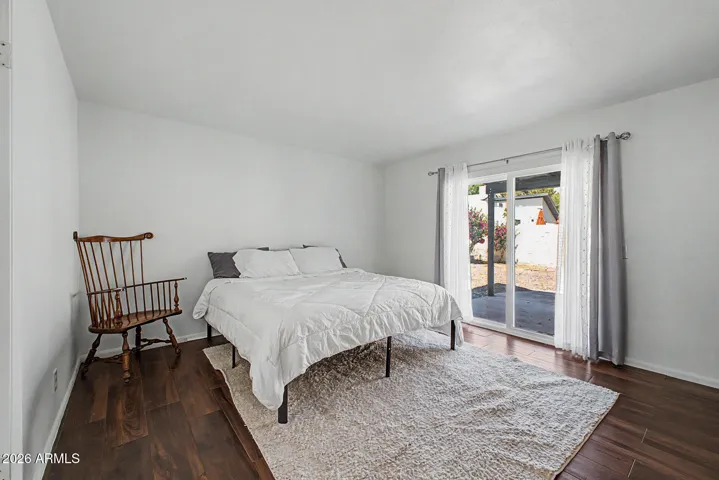 Offers private access to backyard through brand new low e glass slider.