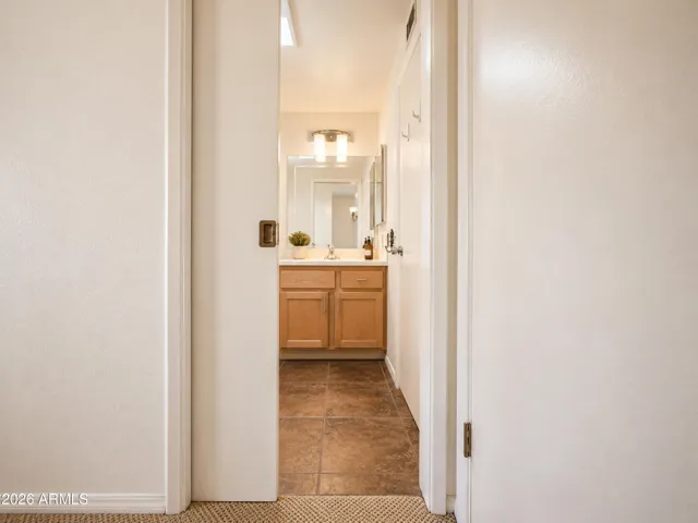 A pocket door from bedroom 2 to the hall bath.