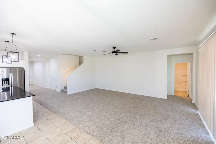 Small hallway to right leads to bedroom and downstairs guest bath