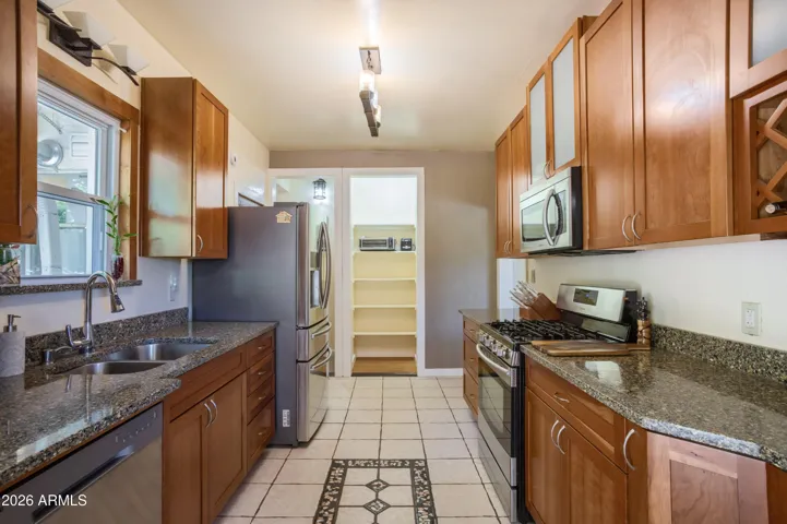 Beautifully updated kitchen with upgraded cabinets and stainless steel appliances (upper level)