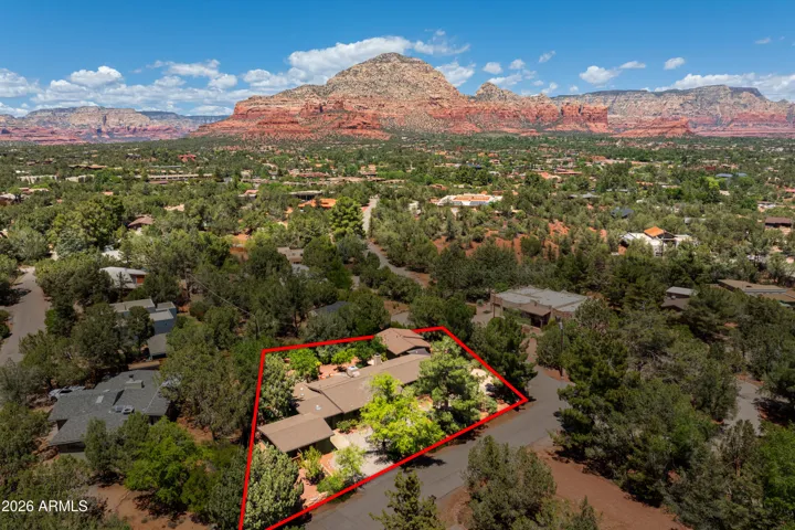 Stunning red rocks in the distance create a peaceful setting