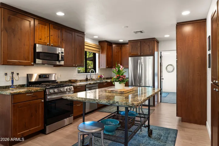 Well appointed kitchen with stunning granite counter tops