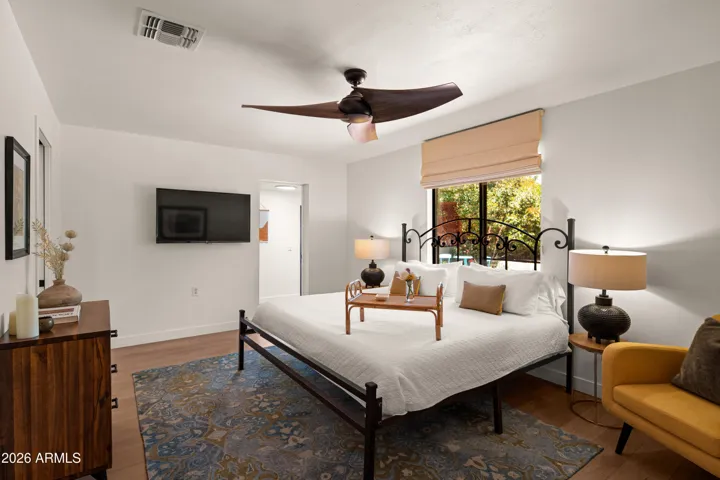 Primary suite offers a relaxing retreat with serene surroundings