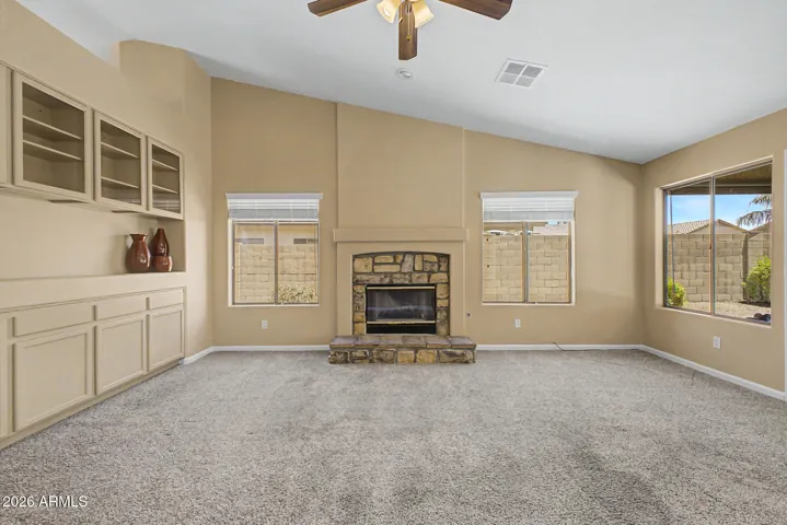 Centered around a Cozy Stone Gas Fireplace