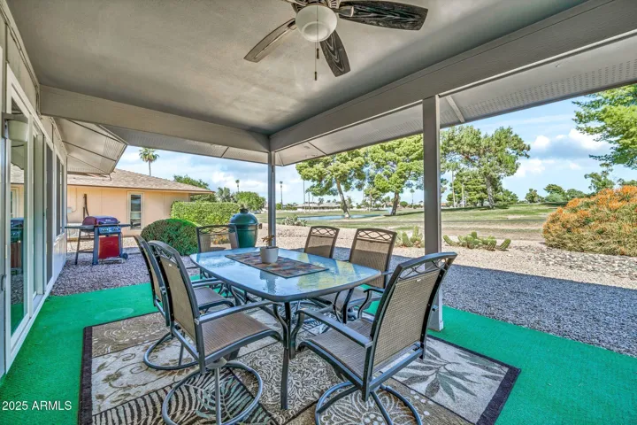 The covered patio with golf course and pond view