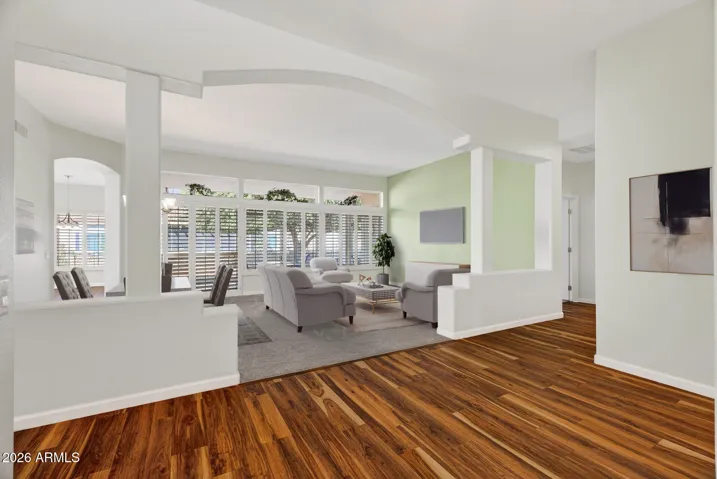 14 VIRTUAL STAGED PHOTO OF VIEW OF LIVING /DINING ROOM FROM FOYER