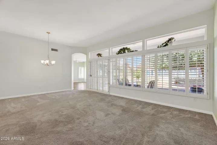 17 REVERSE VIEW OF LIVING ROOM WITH DINING ROOM PHOTO LEFT.