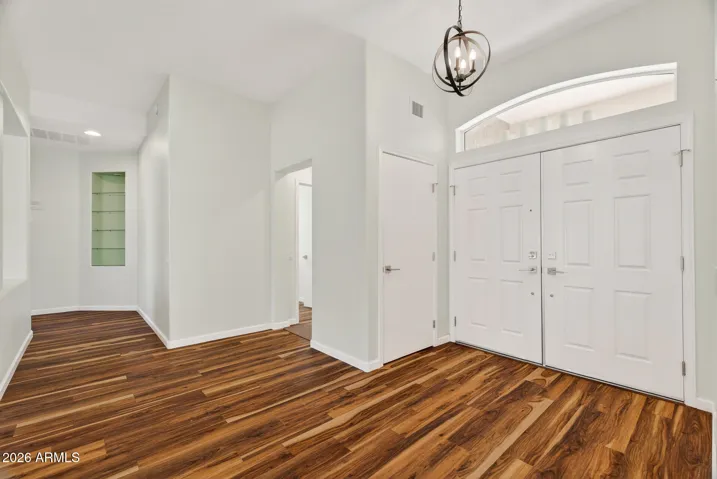 16 VIEW OF ENTRY FOYER FROM DINING AREA.
