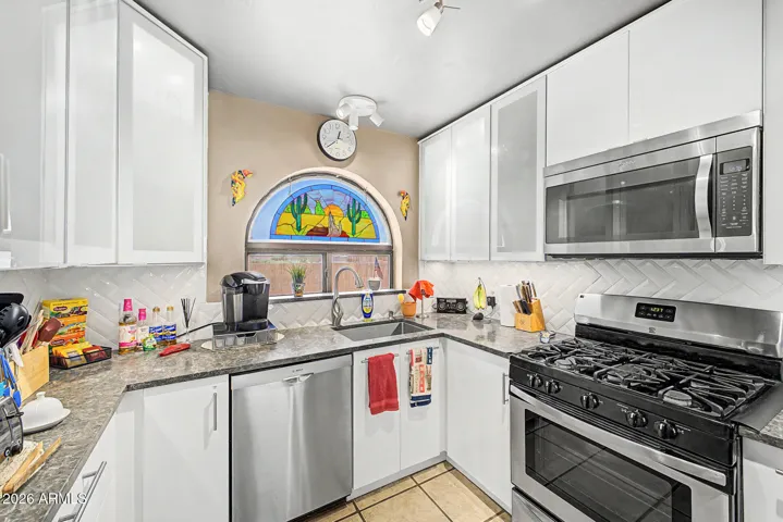 Light-Up cabinets, hidden trash, hidden drawers and pull-out lazy susan.