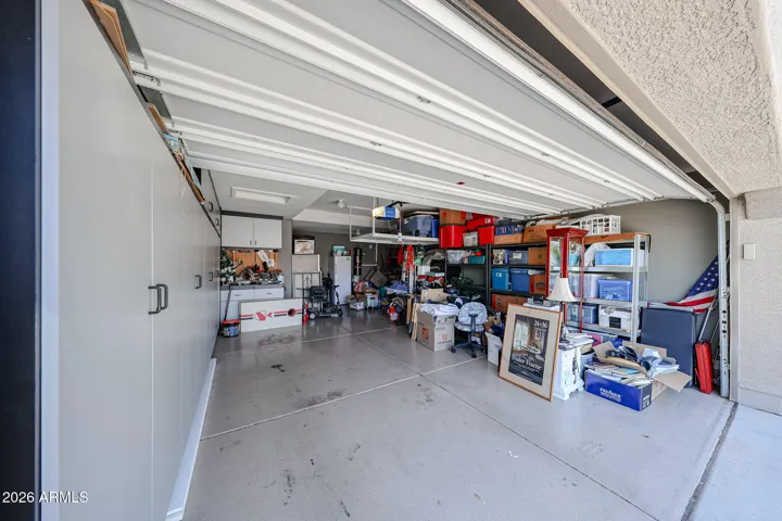 COATED FLOORS & LOTS OF CABINETS!