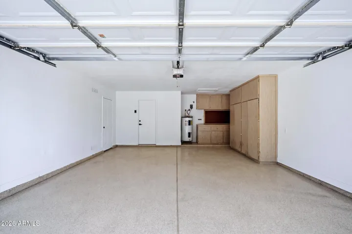 Garage with workbench, cabinets and new epoxy flooring