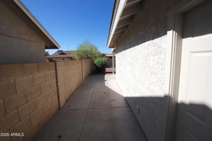 Door from garage to full concrete paved area