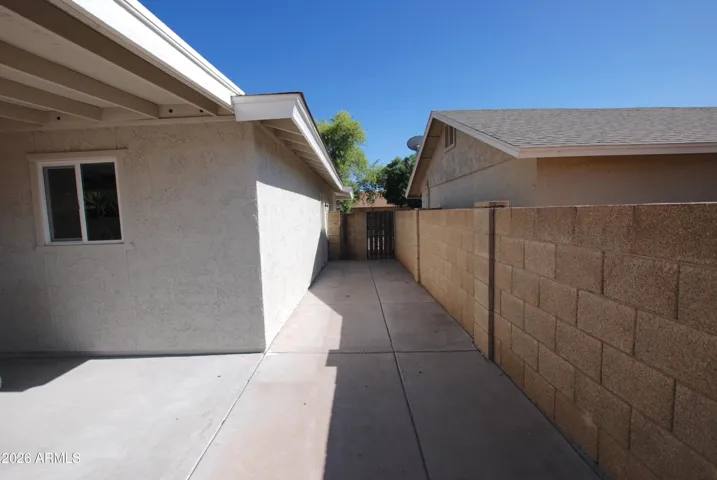 Yard gate side, full paved and garage door access