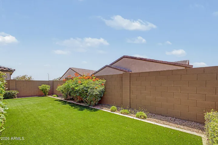 Private, serene backyard is beautifully landscaped
