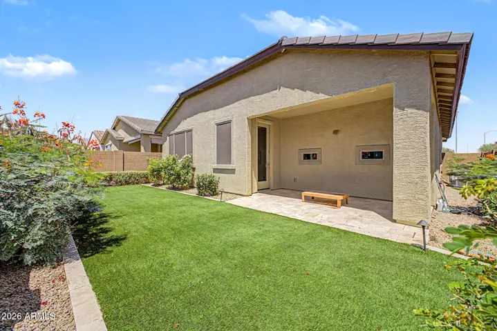 Private, serene backyard is beautifully landscaped