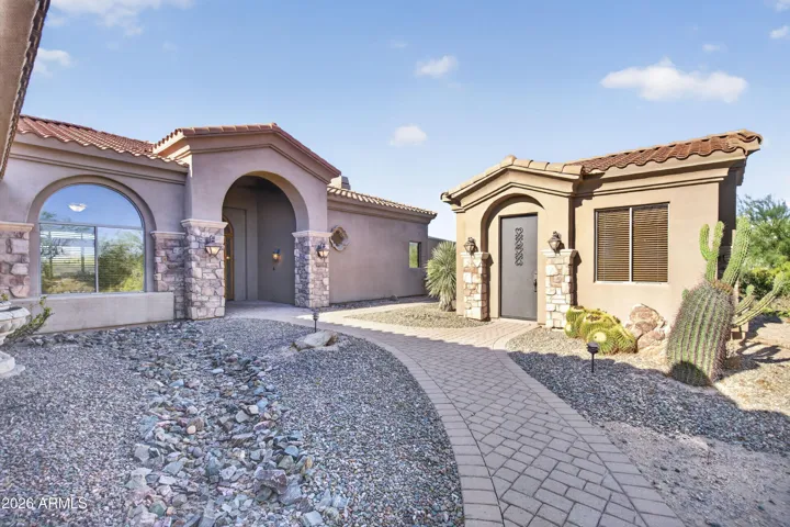 Set on 2.5 acres, with a detached casita, and a detached toy barn / shop / garage.
