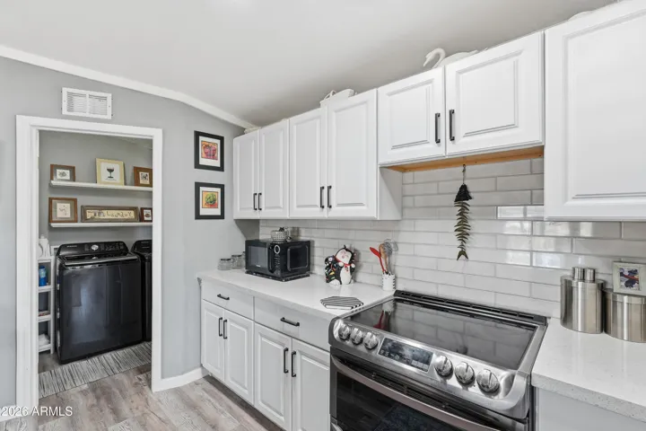 lots of cabinets black stainless steel appliances