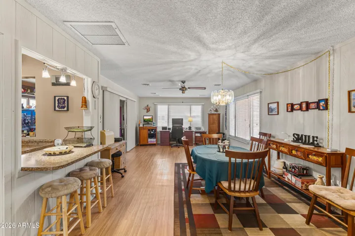 Dining area leads into expanded family room.