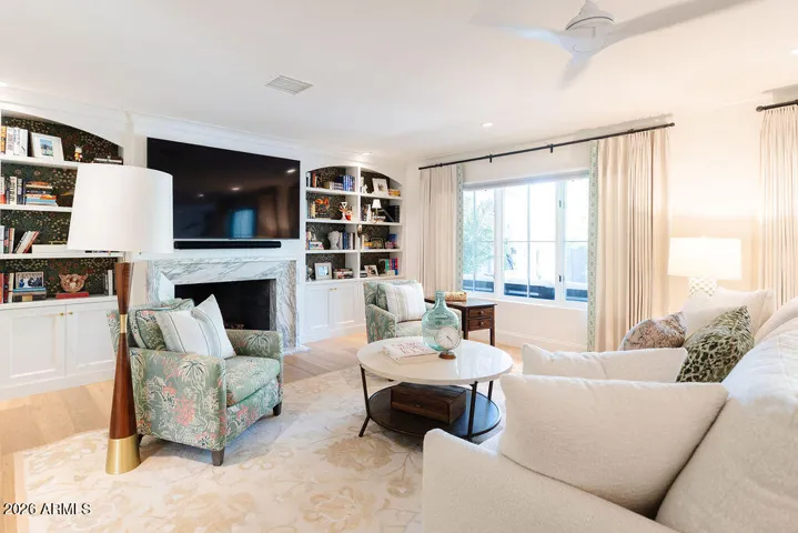 Bookcases and fireplace in cozy family room