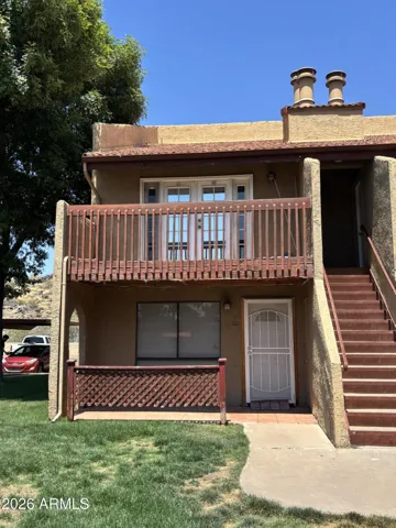 Upstairs unit with french doors and full balcony. Fireplace in Living room.