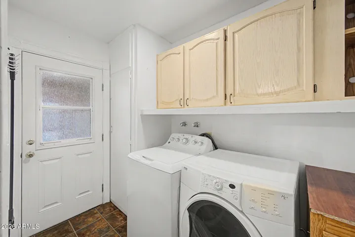 Laundry room washer and dryer included plenty of storage