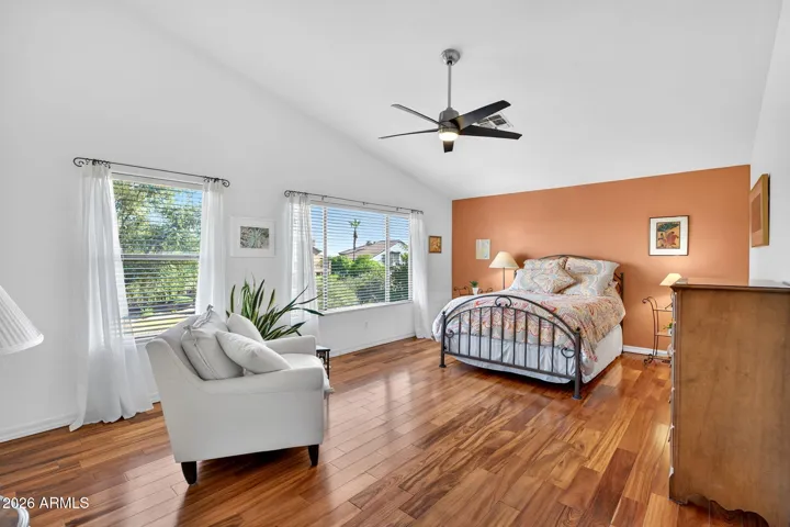 Spacious Primary Bedroom featuring vaulted ceilings