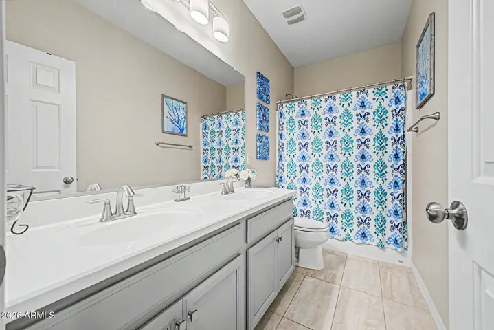 Guest Bathroom with dual sinks.