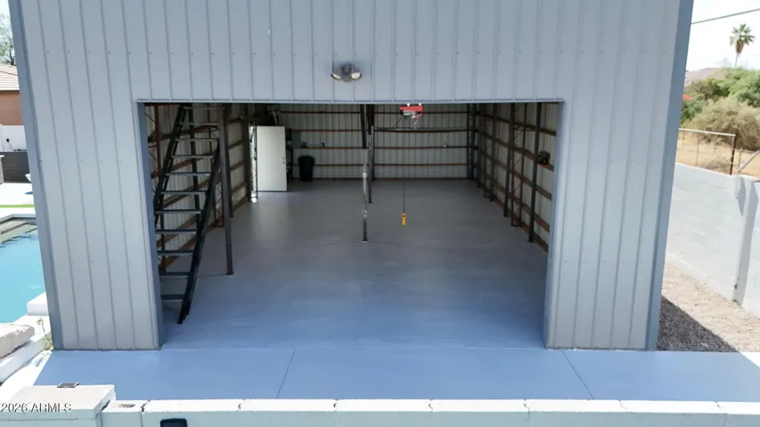 Huge workshop with tons of lighting and a large loft